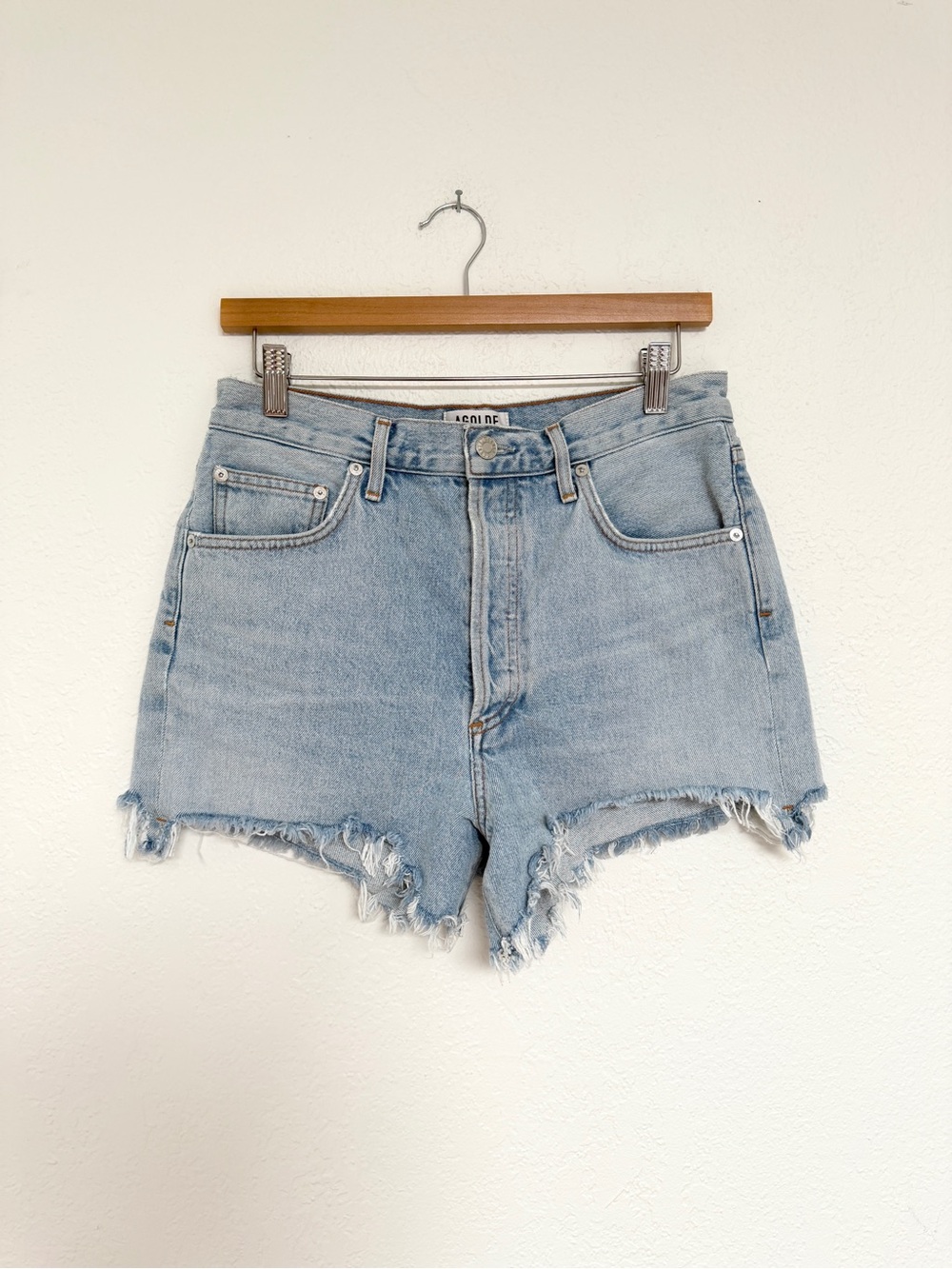 AGOLDE light blue high rise distressed denim cut off jean shorts / size 29